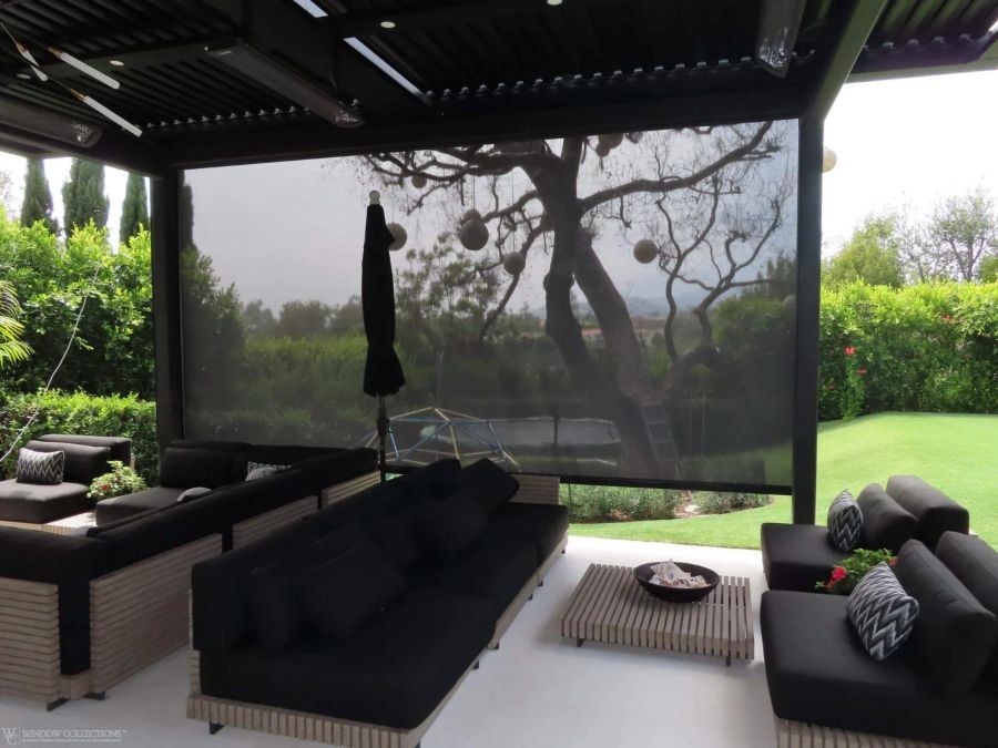An outdoor seating area under a pergola.